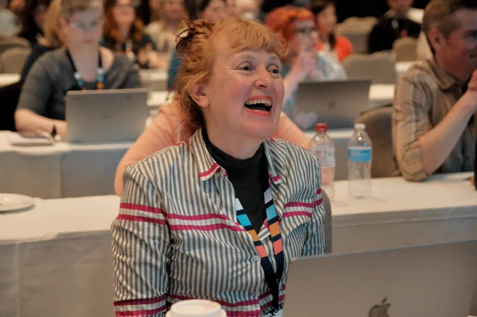 Erika Hall laughs from the Confab audience.