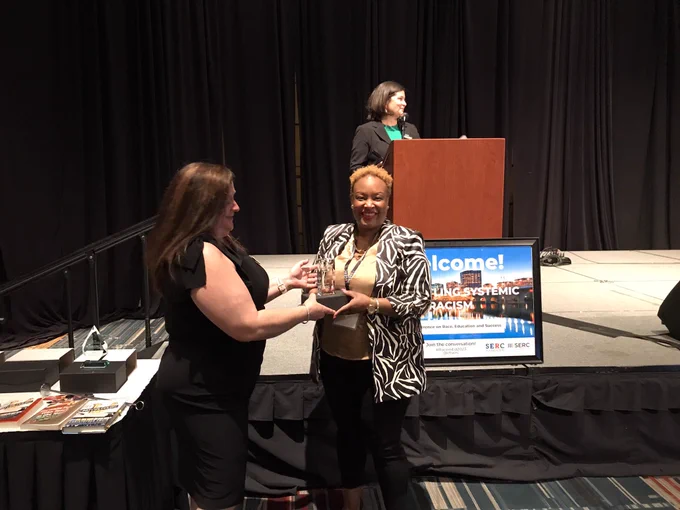 Dr. Shinn with award