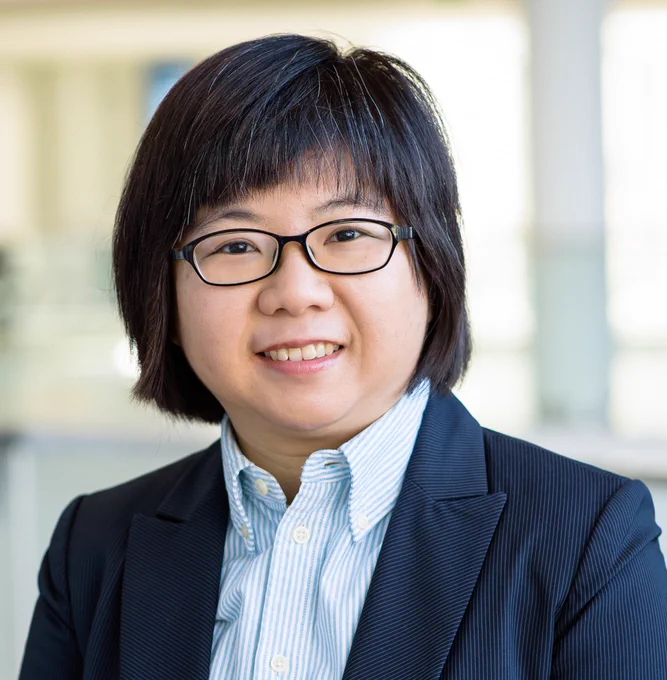 Photo of Prof. Grace Chen in blue formal attire