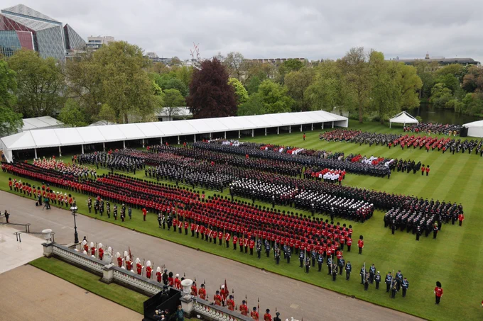 The Coronation Procession finishes the parade on the lawn of Buckingham Palace.