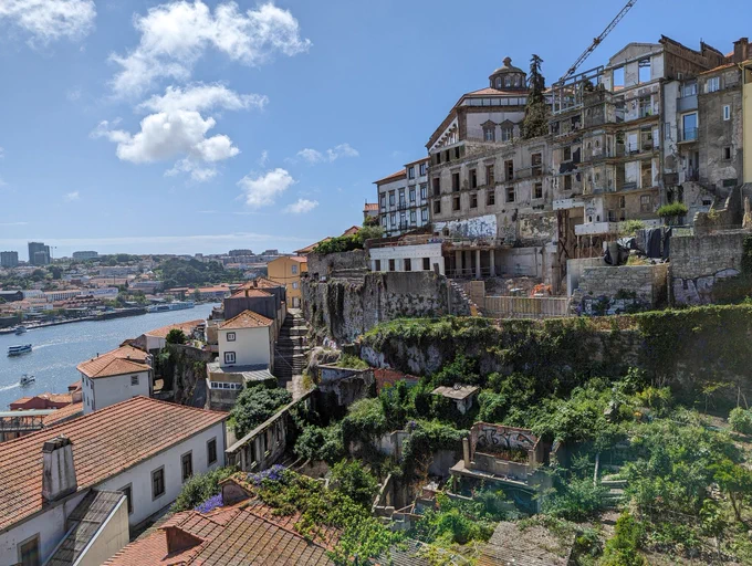Old buildings on a hill and sliver of river, Porto. 