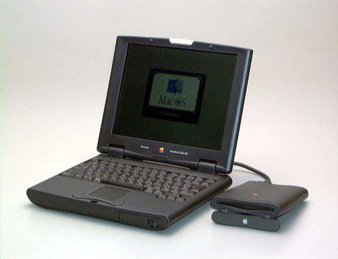 A PowerBook 2400c with an external drive attached.