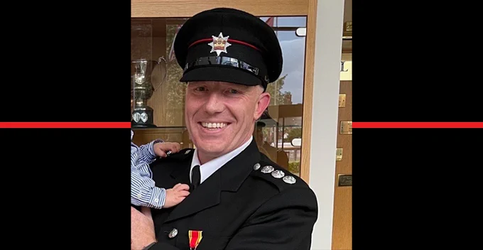 Station Commander Simon Wheatley with a thin red line behind his photograph.
