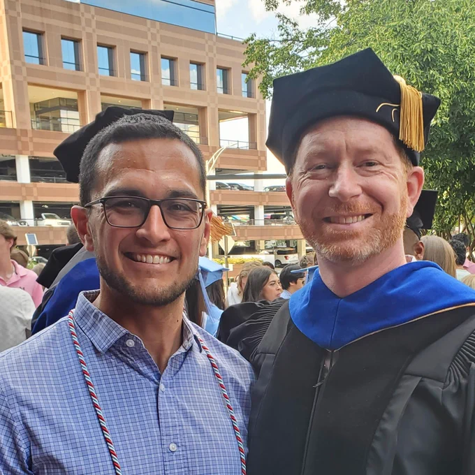 Graduation picture of Ricky & Jason together