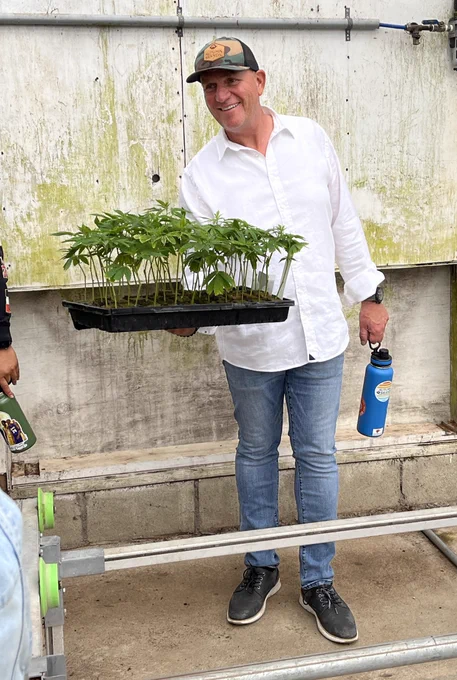 CEO Hans Brand displays some plants to the group.