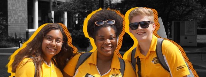 Three Orientation guides in yellow polos stand against a black-and-white background of university buildings and smile at the camera. Yellow and polka-dot graphic elements are layered behind the students.