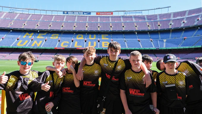 Team from Mosslands pose in front of the Nou Camp pitch on a Rayburn Tours Football School Trip