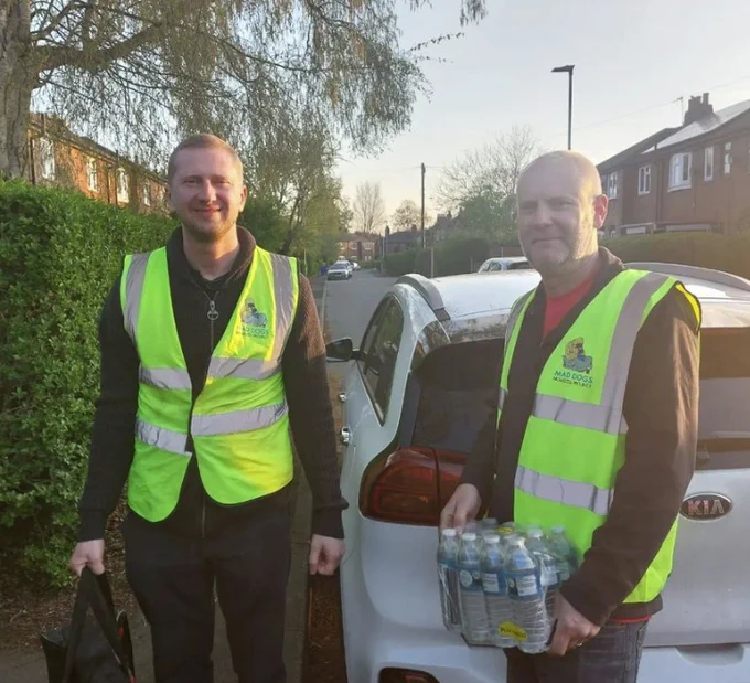 Mad Dogs Homeless Project volunteers delivering resources