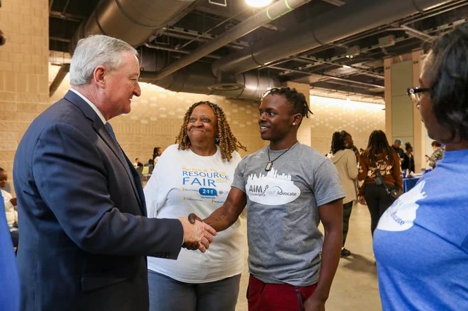The Mayor shakes hands with a teen at the Parent and Youth Resource Fair