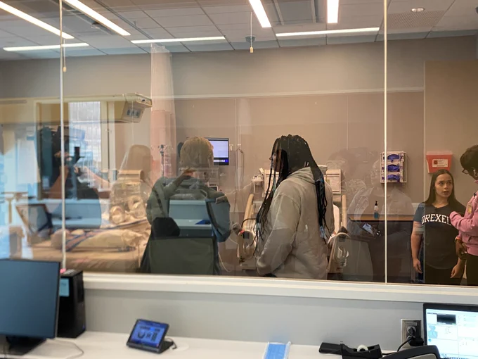 Women in a practice hospital room 