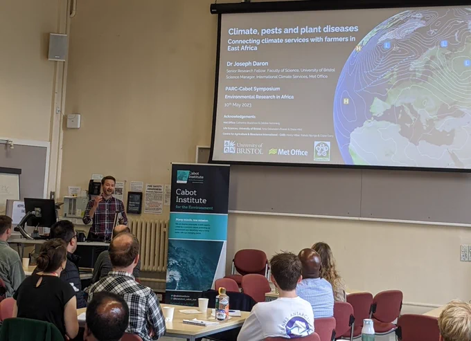 Joe Daron speaks to a room of academics at the university of Bristol.