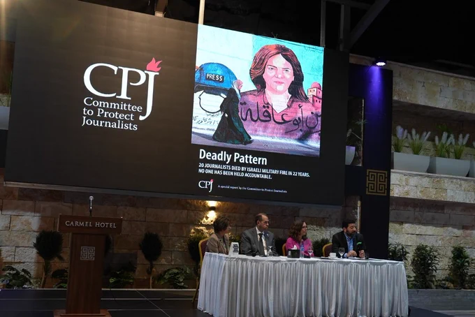 Panelists sit in front of a projector with the CPJ logo and the cover of CPJ's new report, "Deadly Pattern: 20 journalists died by Israeli military fire in 22 years. No one has been held accountable."

Photo credit: Waleed Kamar