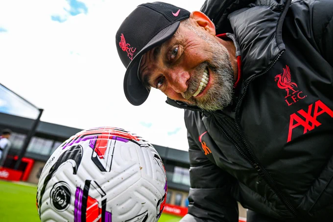 Jürgen Klopp looks directly into the camera alongside a Nike Premier League ball during today's training session.