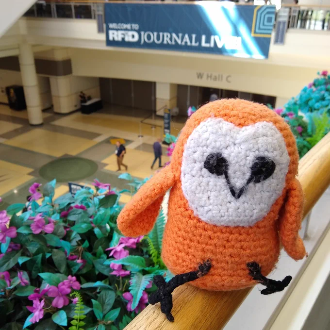 Mrs. Barnowl poses in front of the RFID Journal Live banner in Orlando.
