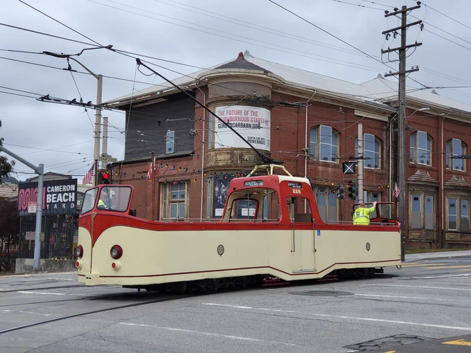 red boat tram in front of yard