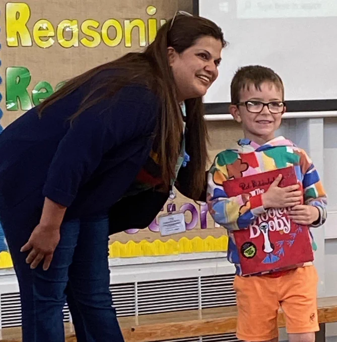 member of staff and child
