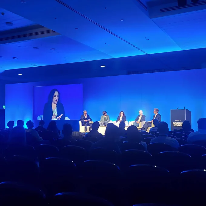 Sigal on stage as part of a panel discussion