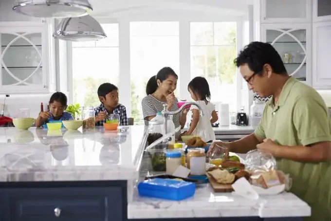 Family preparing a meal in the kitchen