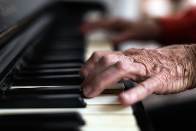 A close-up of a person playing the piano. 