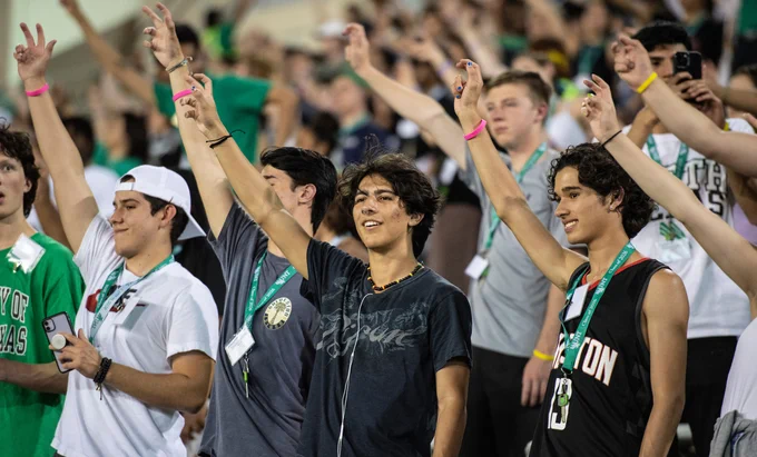Students throwing up the Eagle Claw. 