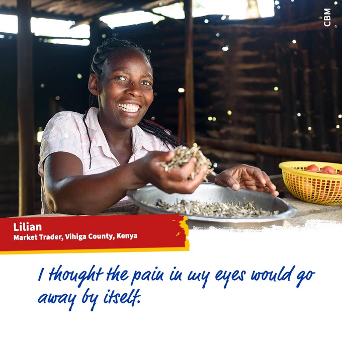 A smiling young woman at work in the market where she golds up a handful of the grain she sells.