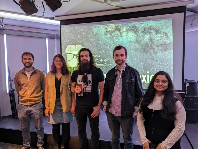 Our five speakers standing at the stage