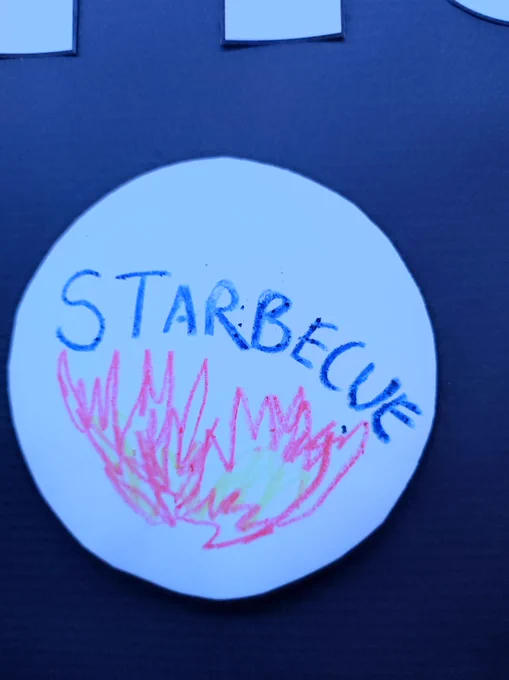 Sticker on galaxy wall saying "Starbecue" with some flames drawn on