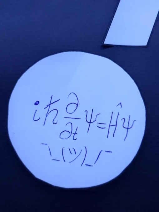 Sticker from the galaxy wall with a quantum mechanics equation written on it 