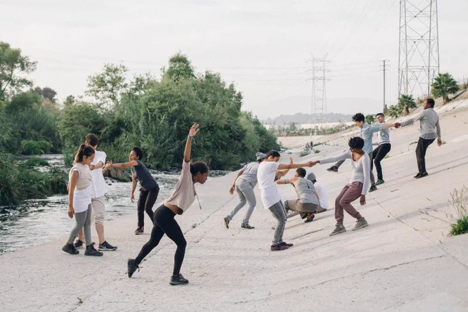 dancers perform in an outdoors setting