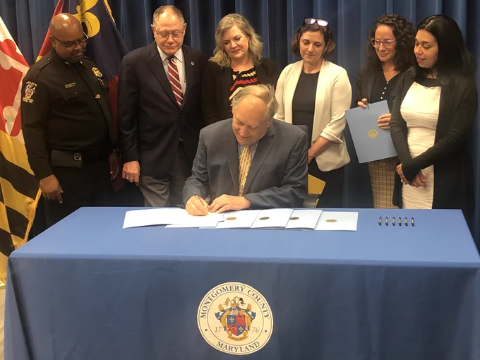 County Executive Marc Elrich signing Bill 14-23 - Police – Late Night Business Safety Plan