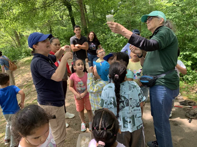 Pond life instructors, teaching a lesson and exploration to our first graders.