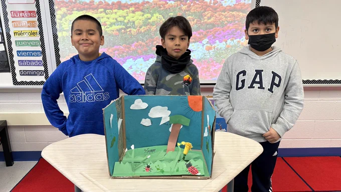 Presenting the ladybug garden to class in Spanish