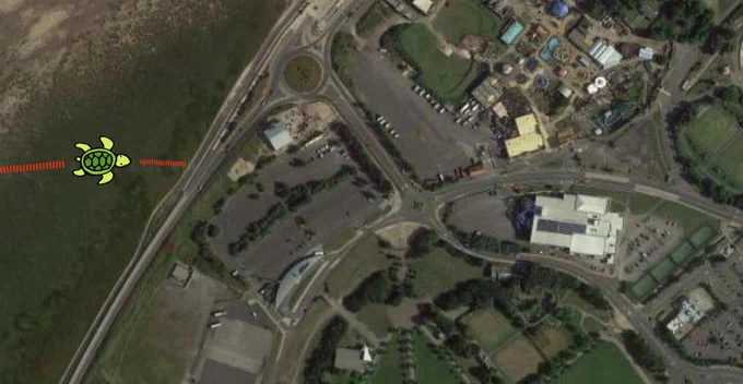 An aerial view of Southport with a turtle image overlayed showing it moving towards the town centre