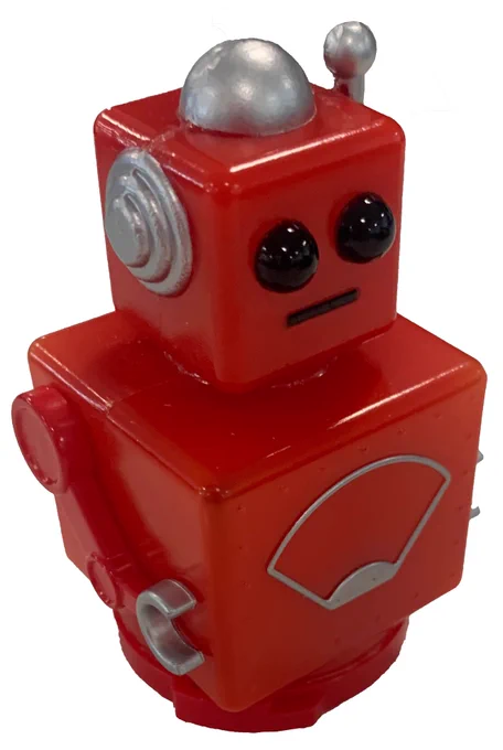 A red toy robot - very shiny but with a slightly sad expression