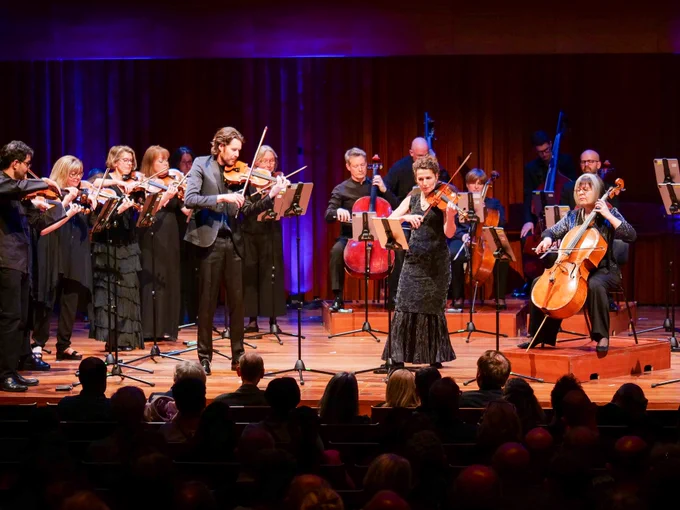 Violinists Thomas Gould and Miranda Dale performing with Britten Sinfonia's other string players.  