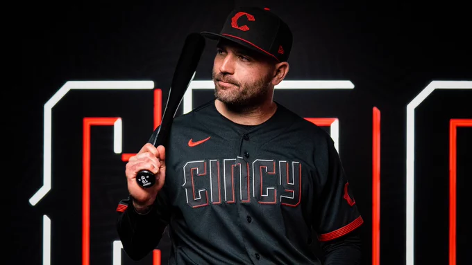 Joey Votto poses while wearing the Reds new city connect uniforms. 