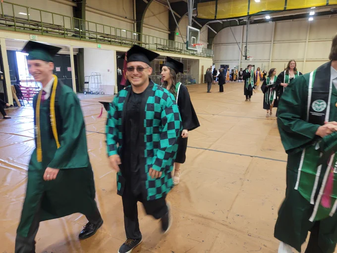 Smiling graduates arriving in Moby