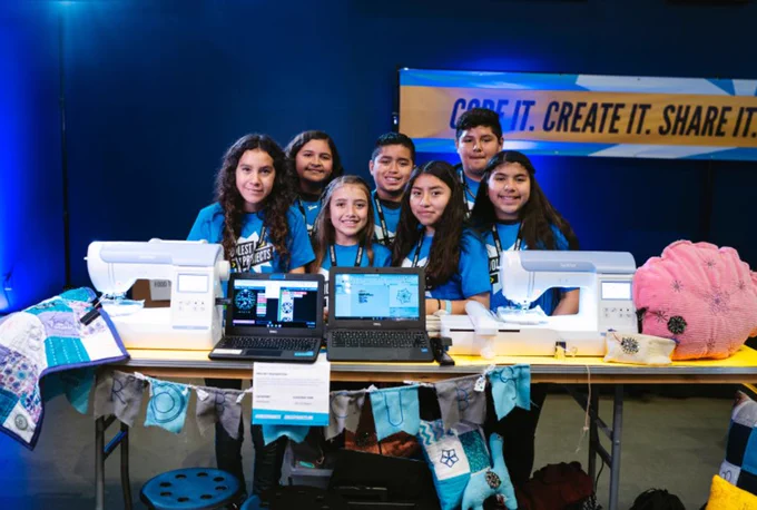 Team of young creators showcasing their projects at a Coolest Projects event.