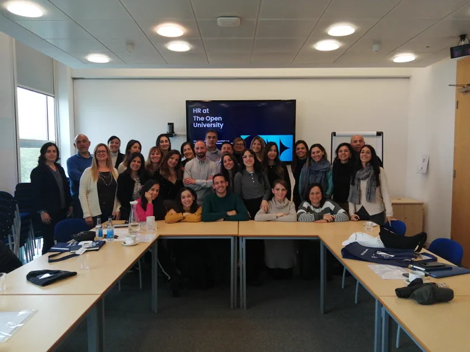 University of Cagliari students pose together in the Library at the OU's Milton Keynes campus