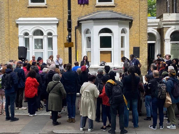 The pic is of Haringey residents gathering outside the former home of the world-renowned, Tottenham-based textile artist Althea McNish on West Green Road ahead of a blue plaque unveiling in her honour today (Monday 15 May 2023).