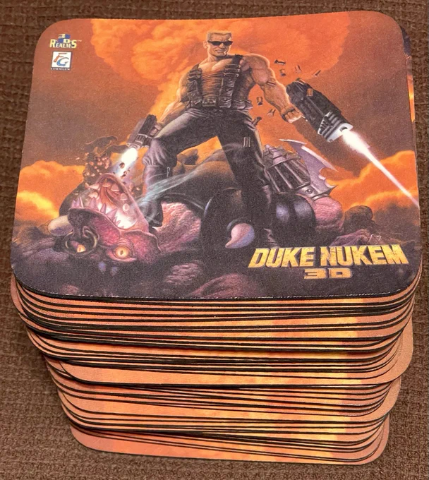 A stack of Duke Nukem 3D Vintage Mousepads.