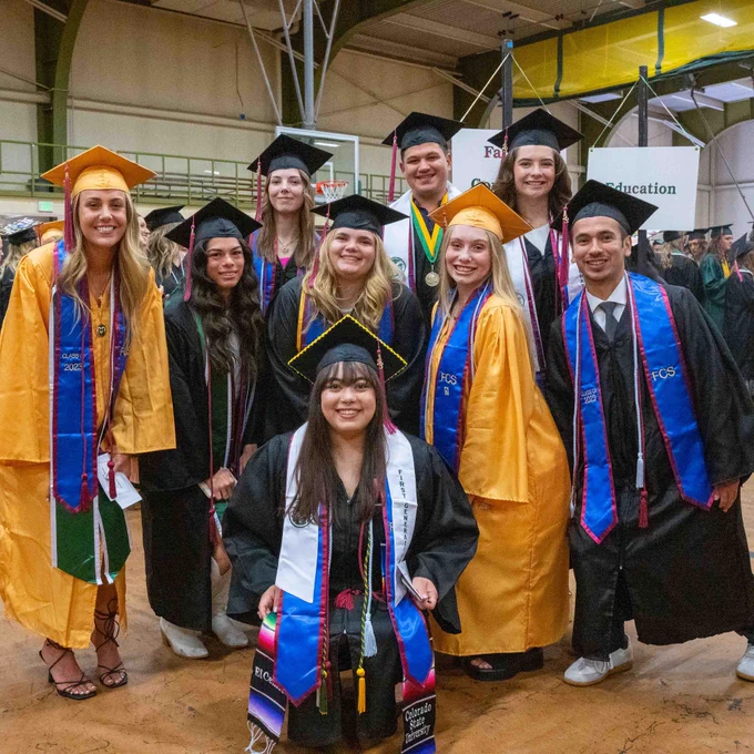 A group of students pose together before entering Moby Areana.