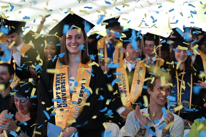 Confetti rains down own new graduates. 