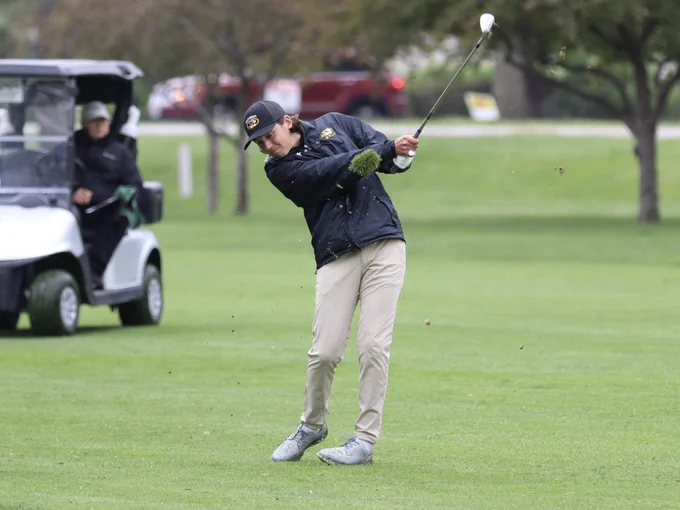 Drake Hull hits an approach shot into the 18th green at the Class A-3 district tournament Monday at Fremont Golf Club.