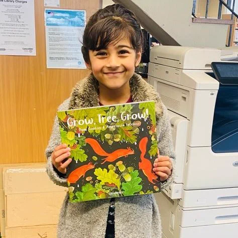 girl holding book