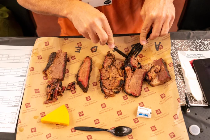 Someone eating a plate of Brisket