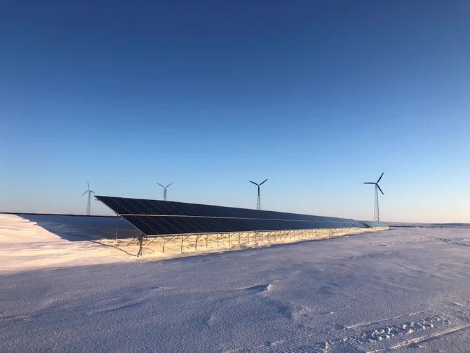 Solar panels and wind turbines in Kotzebue, Alaska. Courtesy of Matt Bergan, Kotzebue Electric. 