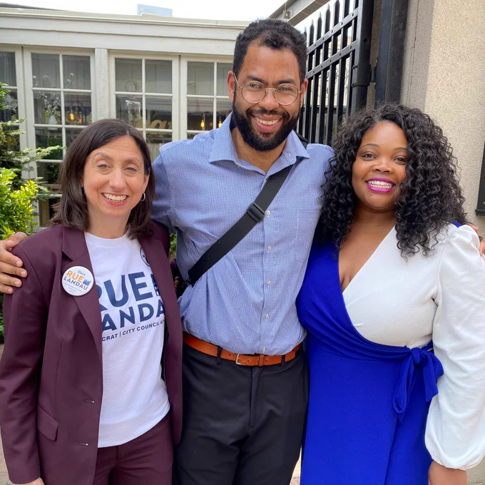 Rue smiles with friends on Election Day
