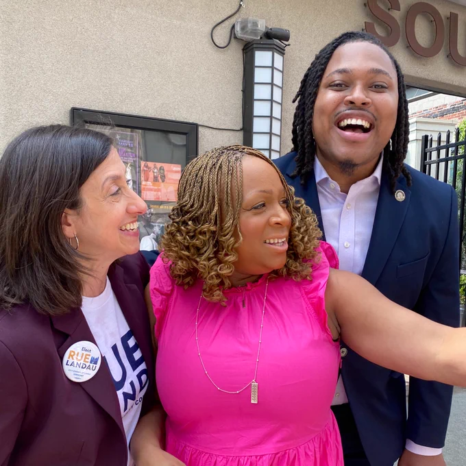 Rue smiles with friends on Election Day