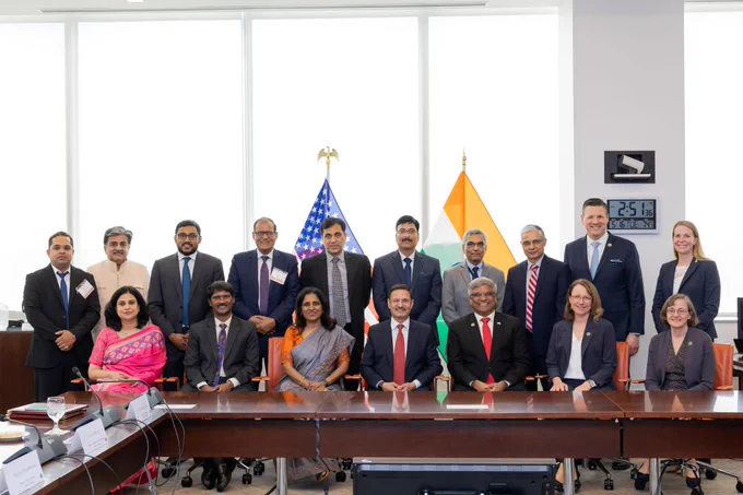 NSF and Indian delegates line up in two rows for a group photo at NSF headquarters.